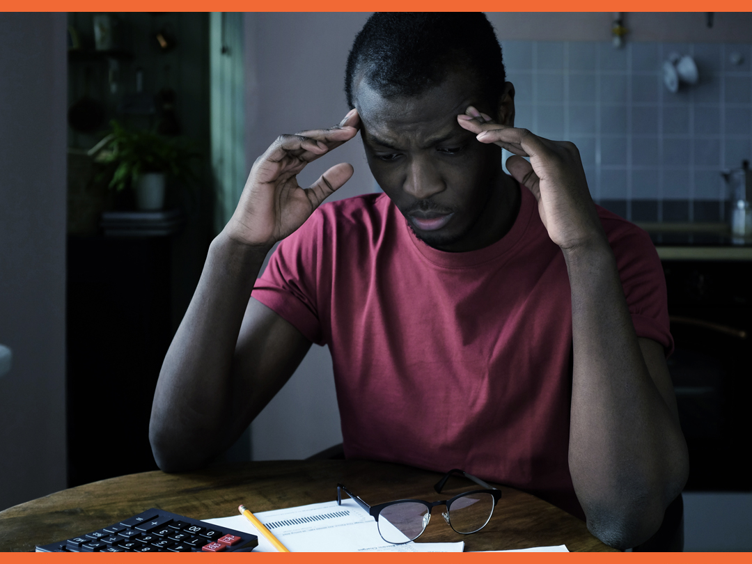 Man worrying and looking at papers about his retirement savings. Man worrying and looking at papers about his retirement savings.