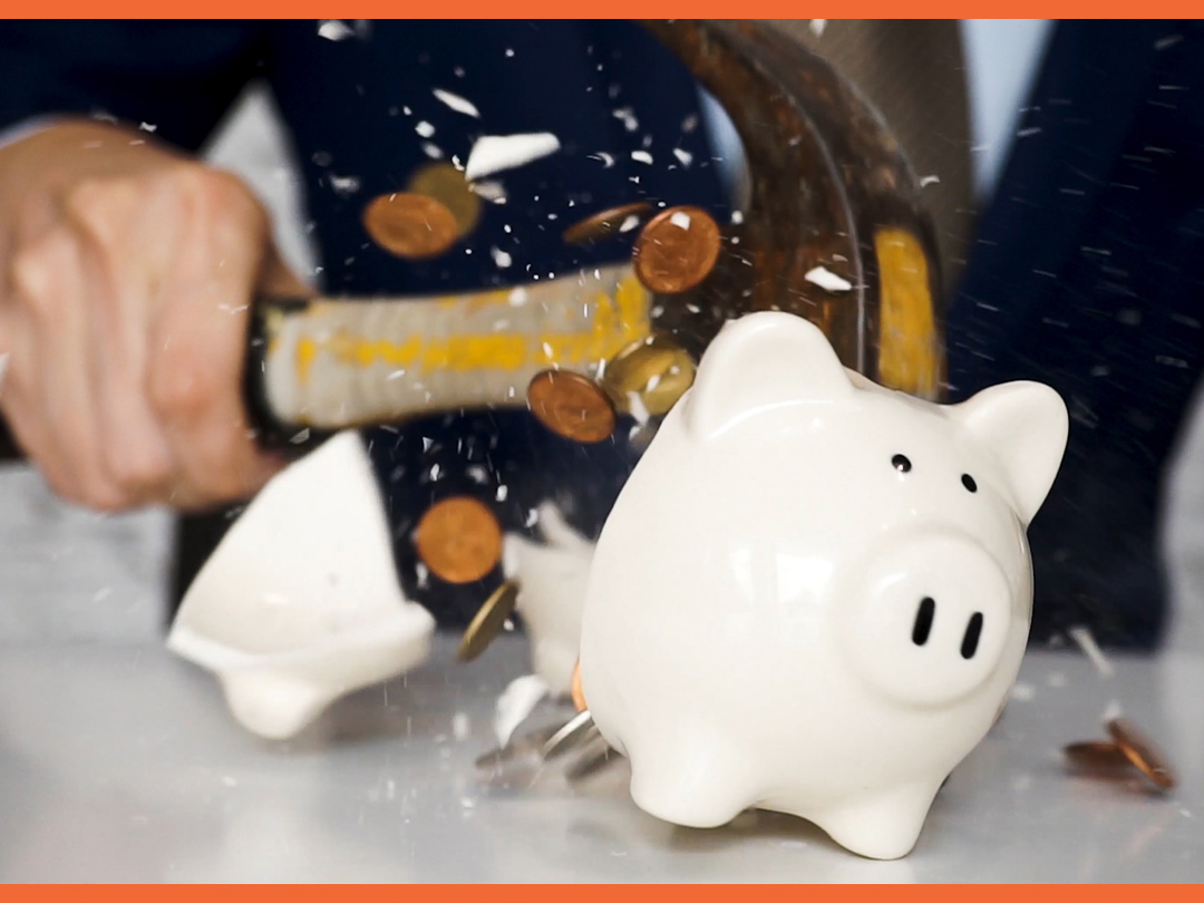 Breaking a piggy bank during a recession.